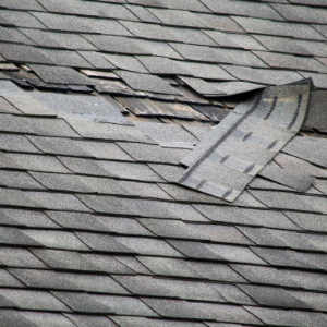 damaged-roof-solar shingles solar panels